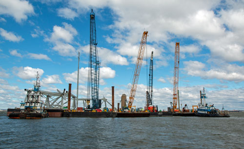 cranes perform salvage at FSK Bridge collapse site in Baltimore April 6, 2024